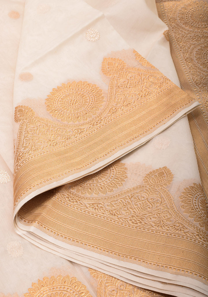 Exquisite Off White Banarasi Kora Silk Saree with Zari Motifs with kadhuwa weave, Grand Pallu and Zari | SILK MARK CERTIFIED | SHOBITAM