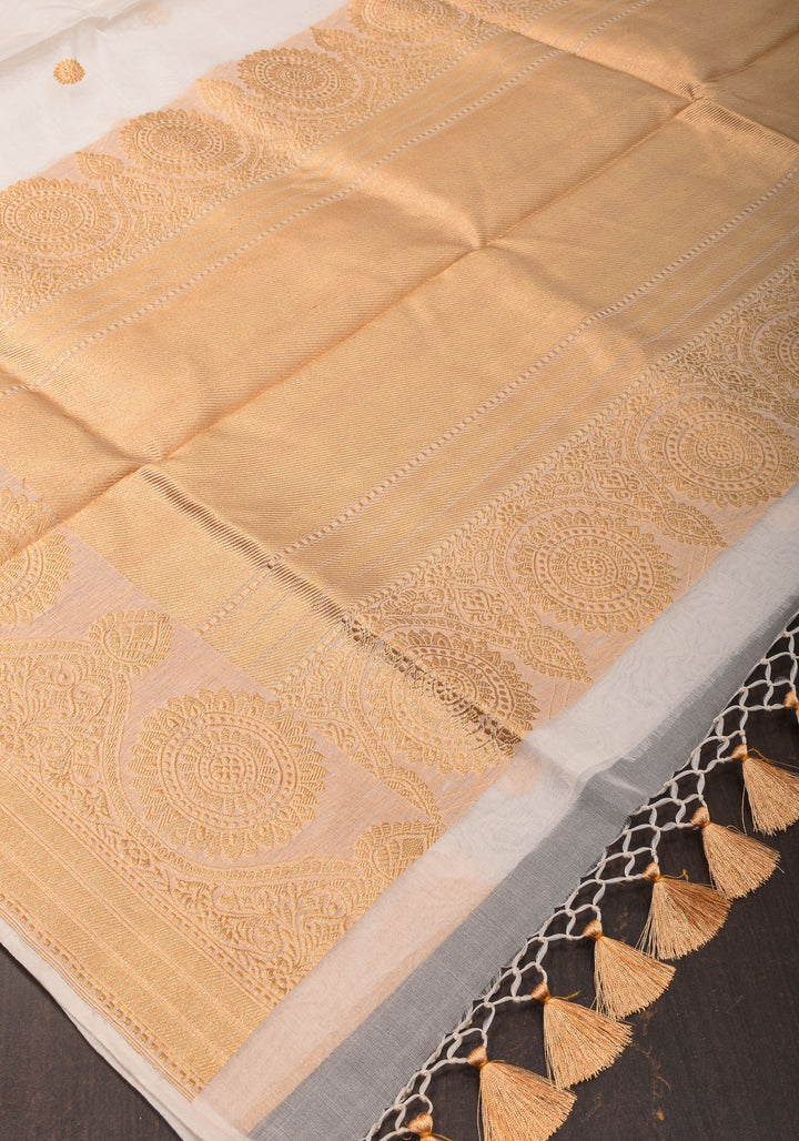 Exquisite Off White Banarasi Kora Silk Saree with Zari Motifs with kadhuwa weave, Grand Pallu and Zari | SILK MARK CERTIFIED | SHOBITAM