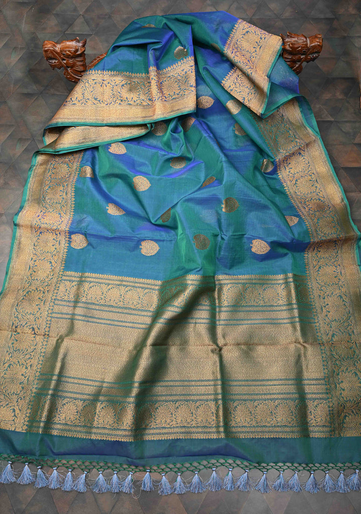 Exquisite Banarasi Kora Silk Saree with antique Zari Motifs and Border in Peacock blue And Green Dual Tone  | SILK MARK CERTIFIED