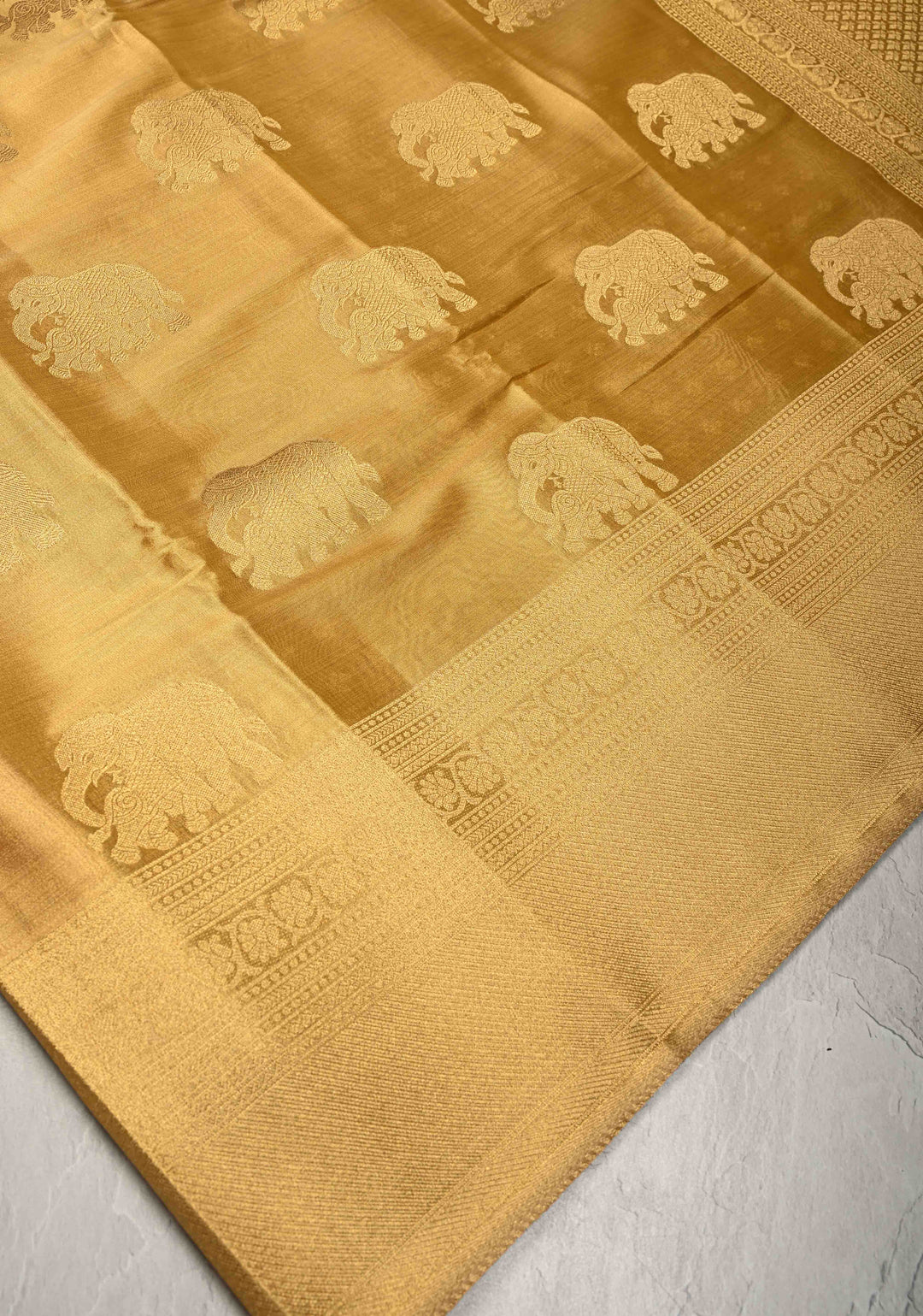 Gold Kanchi Tissue Semi Silk Saree with Elephant Buttas with and Zari Border