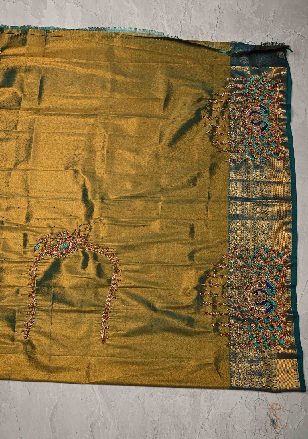 Dusty Orange Dual Tone Kanchi Tissue Semi Silk Saree with Peacock Buttas and Contrast Zari Border