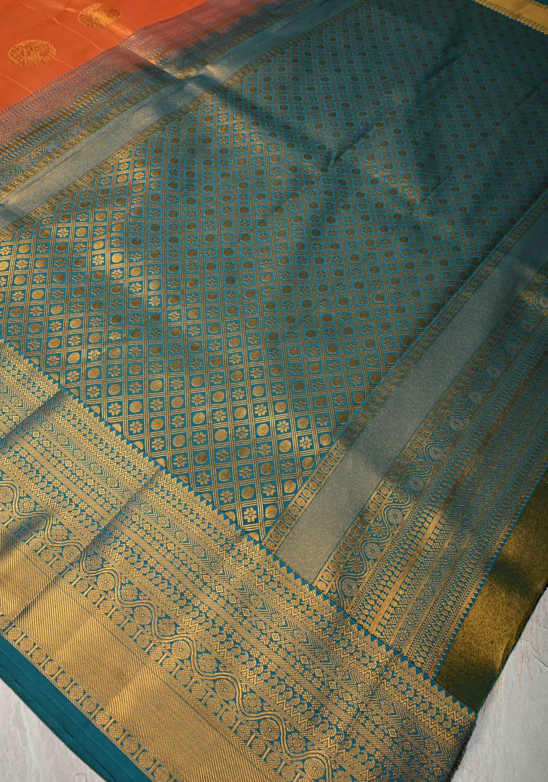 Dusty Orange Dual Tone Kanchi Tissue Semi Silk Saree with Peacock Buttas and Contrast Zari Border