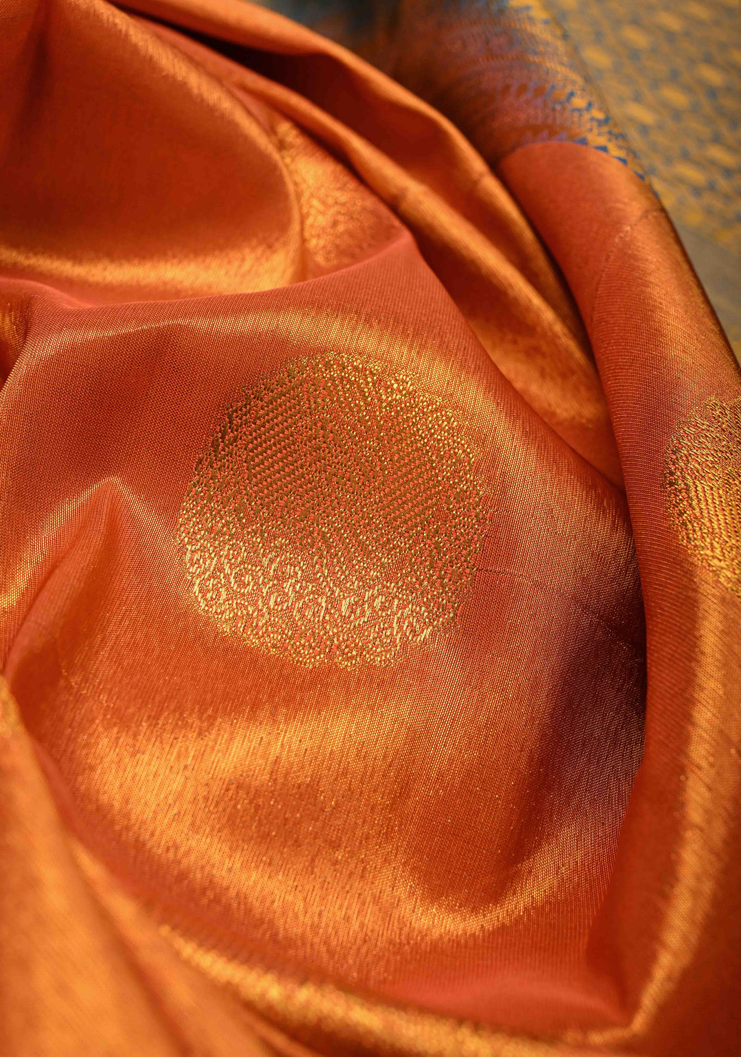 Dusty Orange Dual Tone Kanchi Tissue Semi Silk Saree with Peacock Buttas and Contrast Zari Border