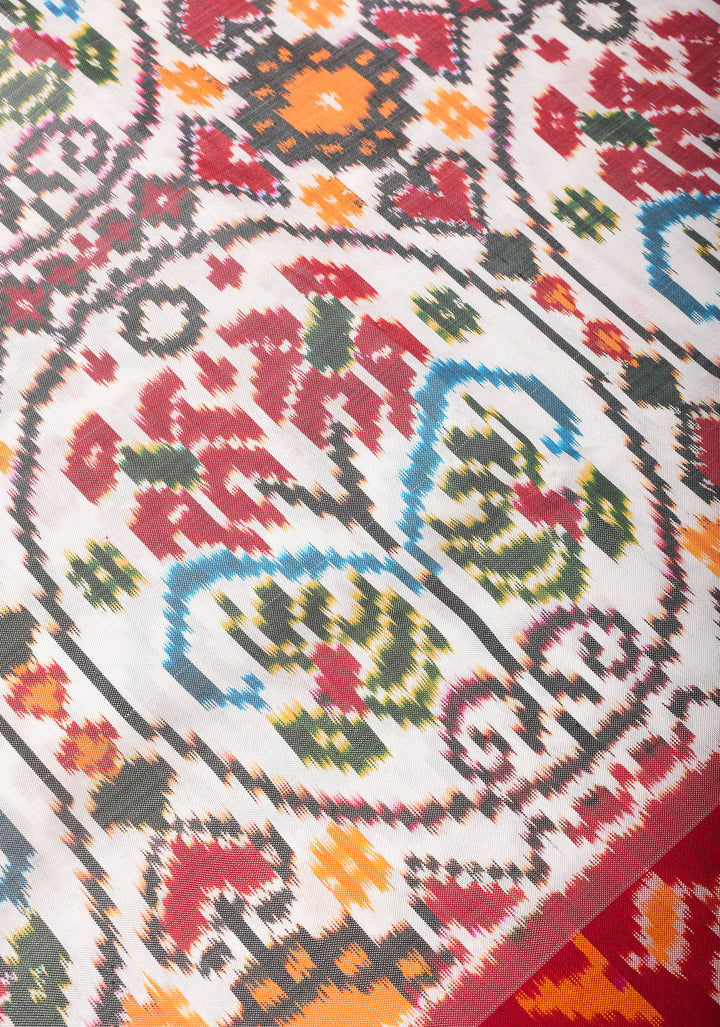 White Pure Silk Saree with Intricate Ikkat patterns and Contrast Red Border | SILK MARK CERTIFIED