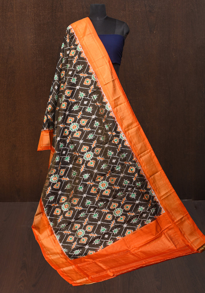 Dupatta : Black and Orange Ikkat Patola Design Pure Silk Dupatta with handmade tassels I SILK MARK CERTIFIED