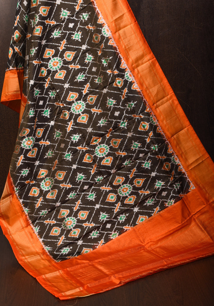 Dupatta : Black and Orange Ikkat Patola Design Pure Silk Dupatta with handmade tassels I SILK MARK CERTIFIED