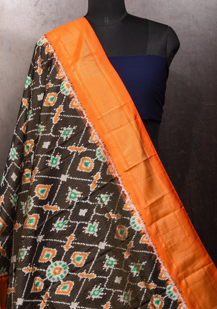 Dupatta : Black and Orange Ikkat Patola Design Pure Silk Dupatta with handmade tassels I SILK MARK CERTIFIED