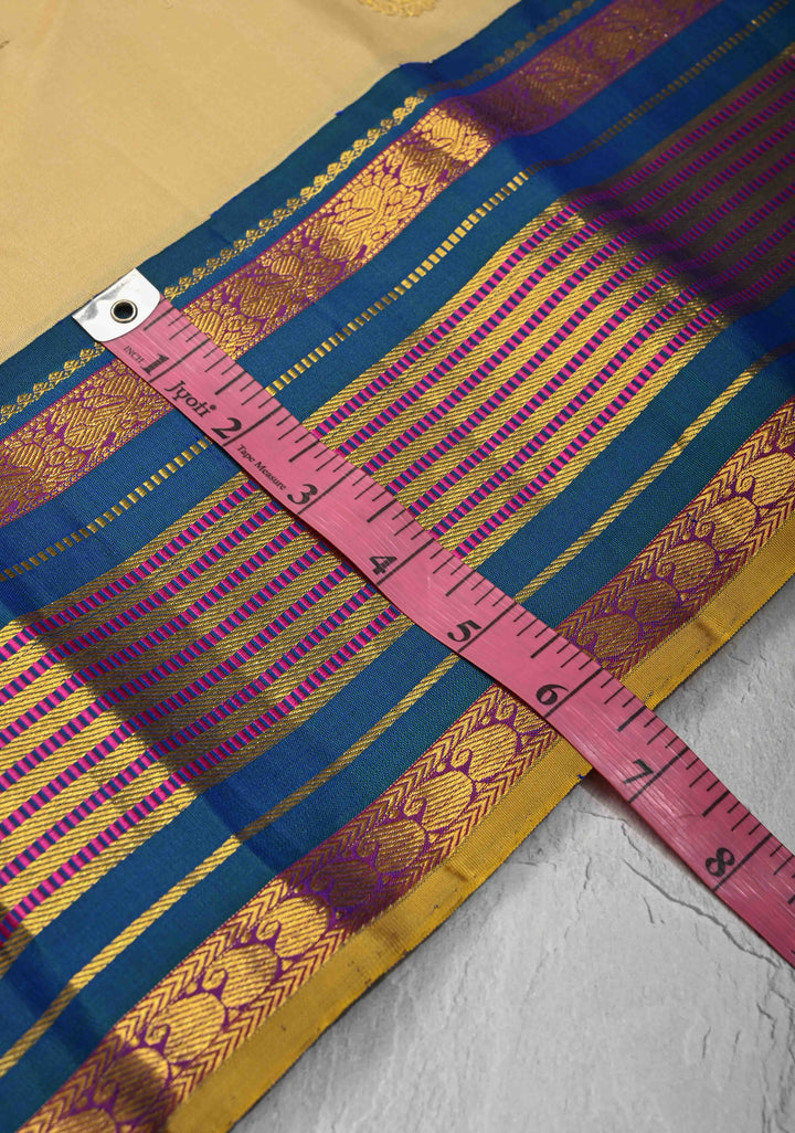 Korvai Cream and Peacock Blue Kanjivaram Pure Silk Saree with Zari Buttas and Contrast Zari Border | SILK MARK CERTIFIED