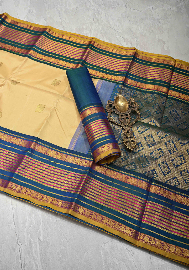 Korvai Cream and Peacock Blue Kanjivaram Pure Silk Saree with Zari Buttas and Contrast Zari Border | SILK MARK CERTIFIED