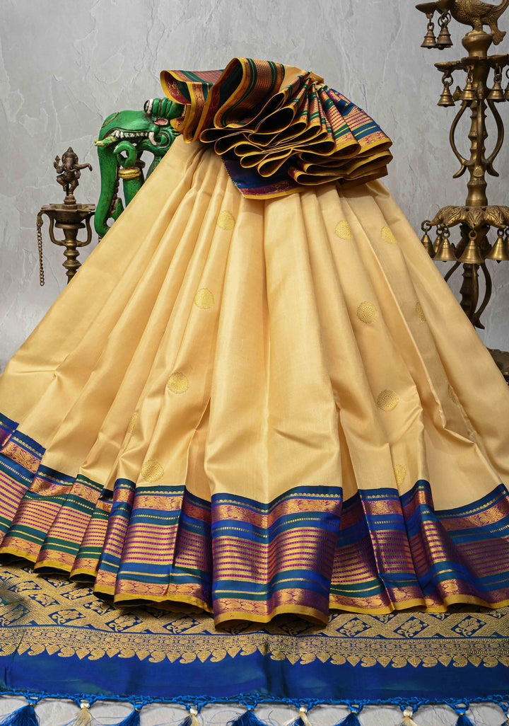 Korvai Cream and Peacock Blue Kanjivaram Pure Silk Saree with Zari Buttas and Contrast Zari Border | SILK MARK CERTIFIED