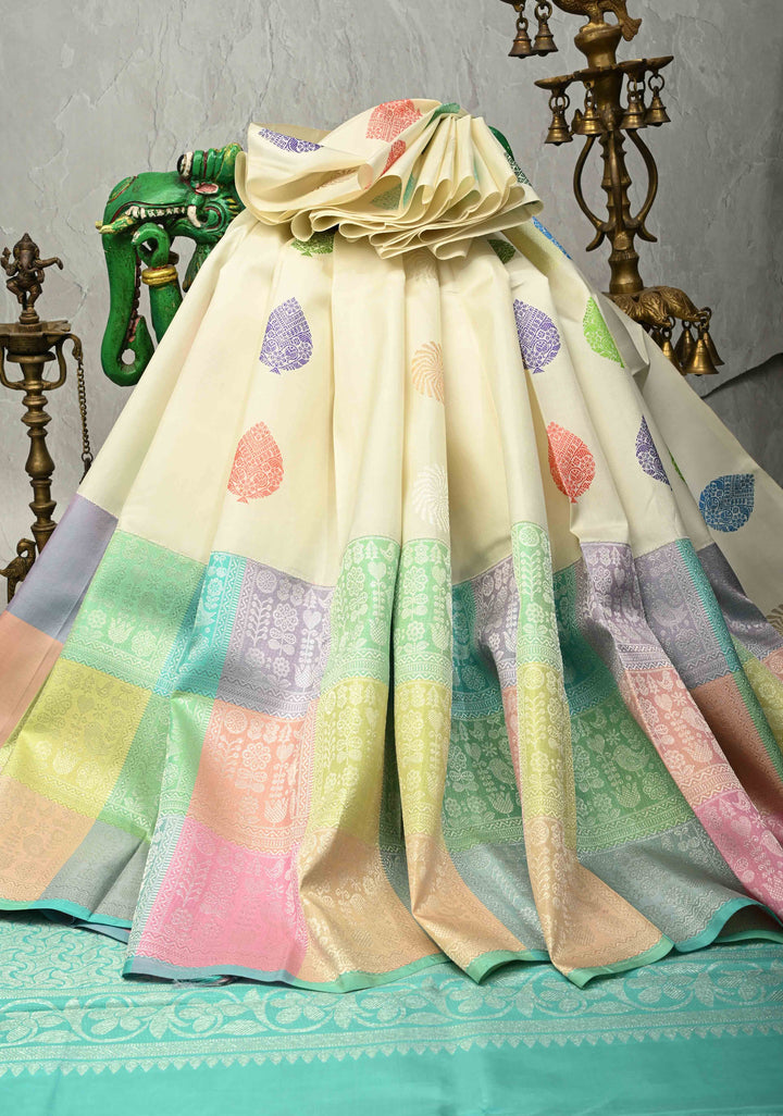 Ivory Handloom Pure Silk Kanchipattu Saree with Resham Meenakari Buttas and Pastel Hued Wide Zari Border | SILK MARK CERTIFIED