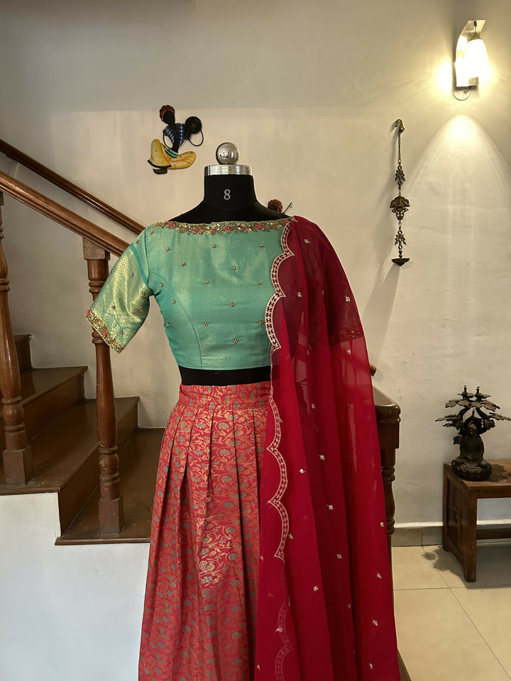 Tomato Red jacquard sea blue semi Kanchi lehenga | SHOBITAM