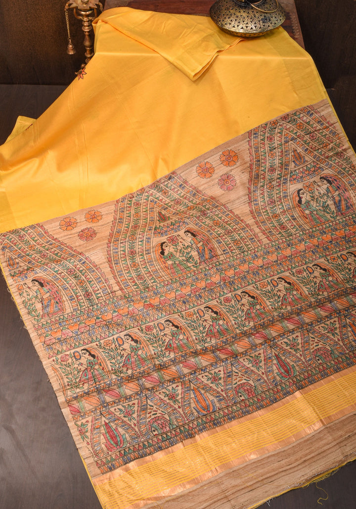 Sulphur Yellow Semi Tussar Silk, adorned with a Madhubani Gecha Tussar Pallu and Zari Border.