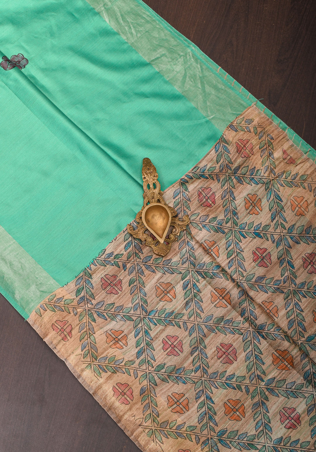 Sea Green Semi Tussar Silk, adorned with a Madhubani Hand painted Tussar Pallu and Zari Border
