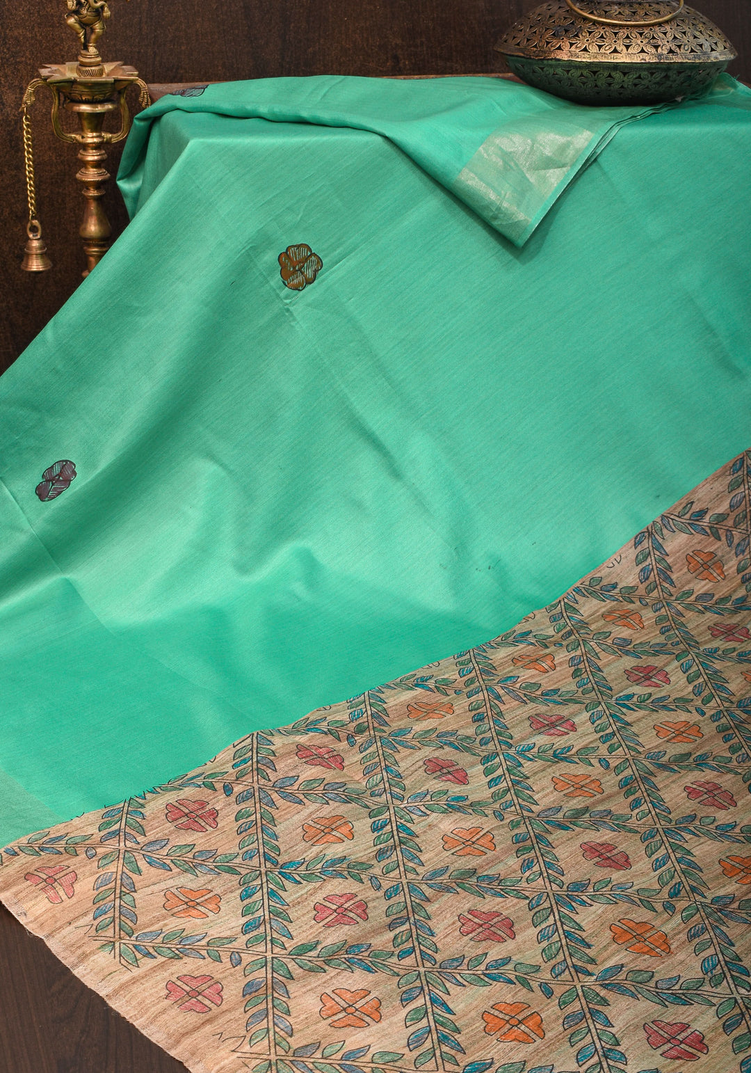 Sea Green Semi Tussar Silk, adorned with a Madhubani Hand painted Tussar Pallu and Zari Border