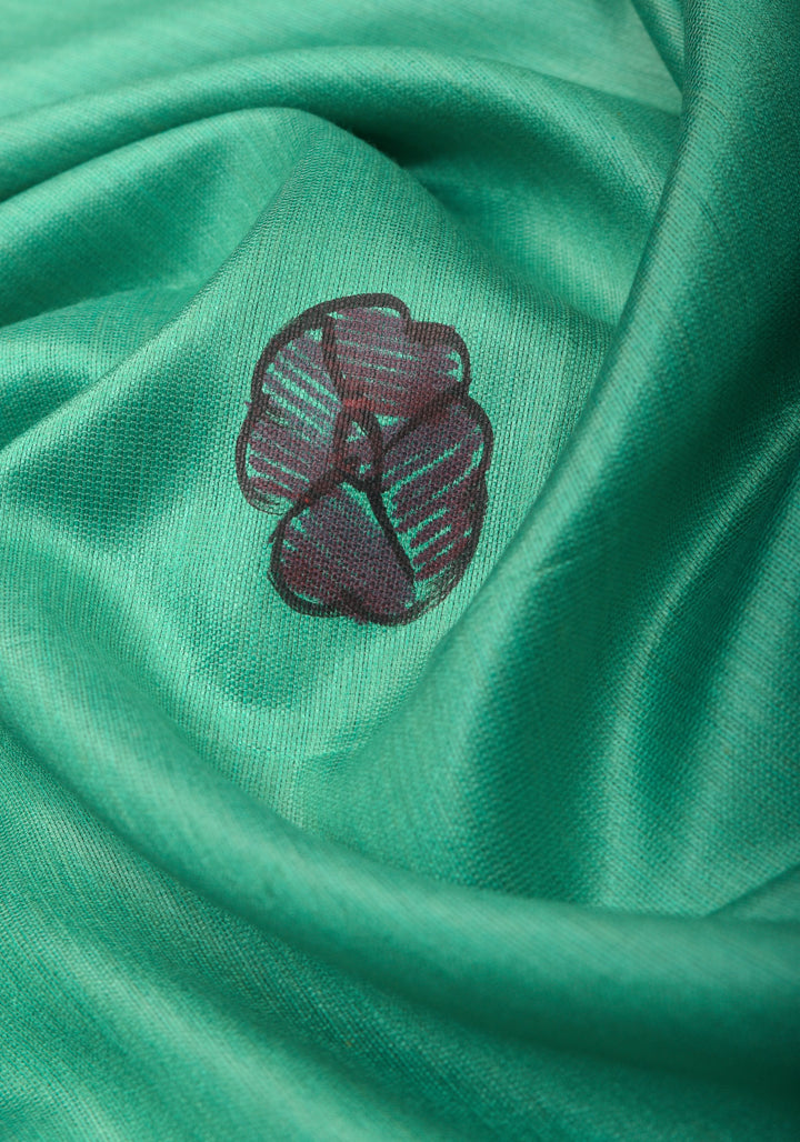 Sea Green Semi Tussar Silk, adorned with a Madhubani Hand painted Tussar Pallu and Zari Border