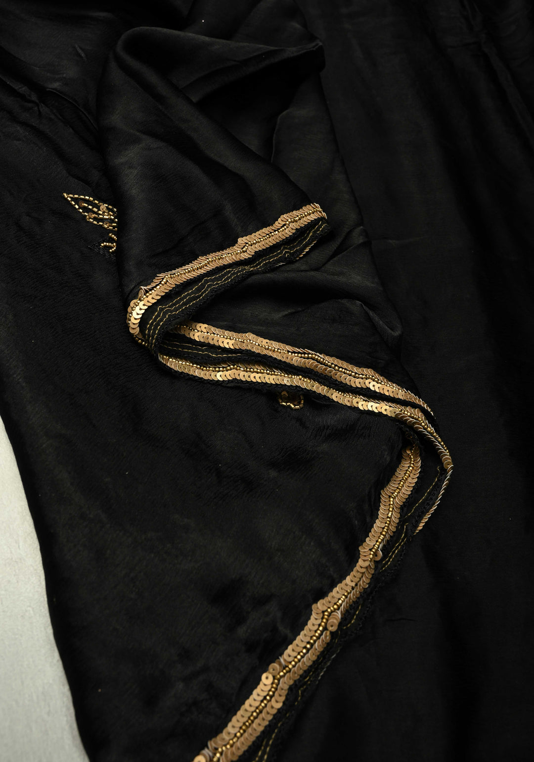 Stunning Black Satin Georgette Saree with Antique Matte Finish Cutdana, Sequins and Moti Embellishment and Scallop Border