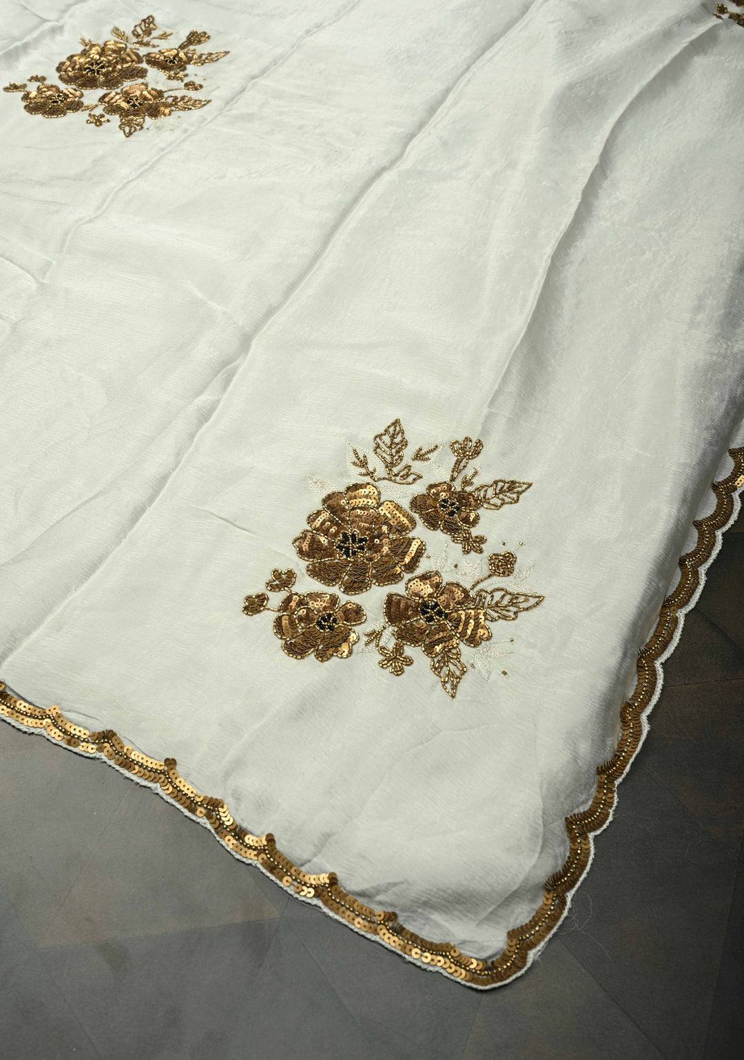 Ivory Satin Georgette Saree with Antique Matte Finish Cutdana, Sequins and Moti Embellishment and Scallop Border