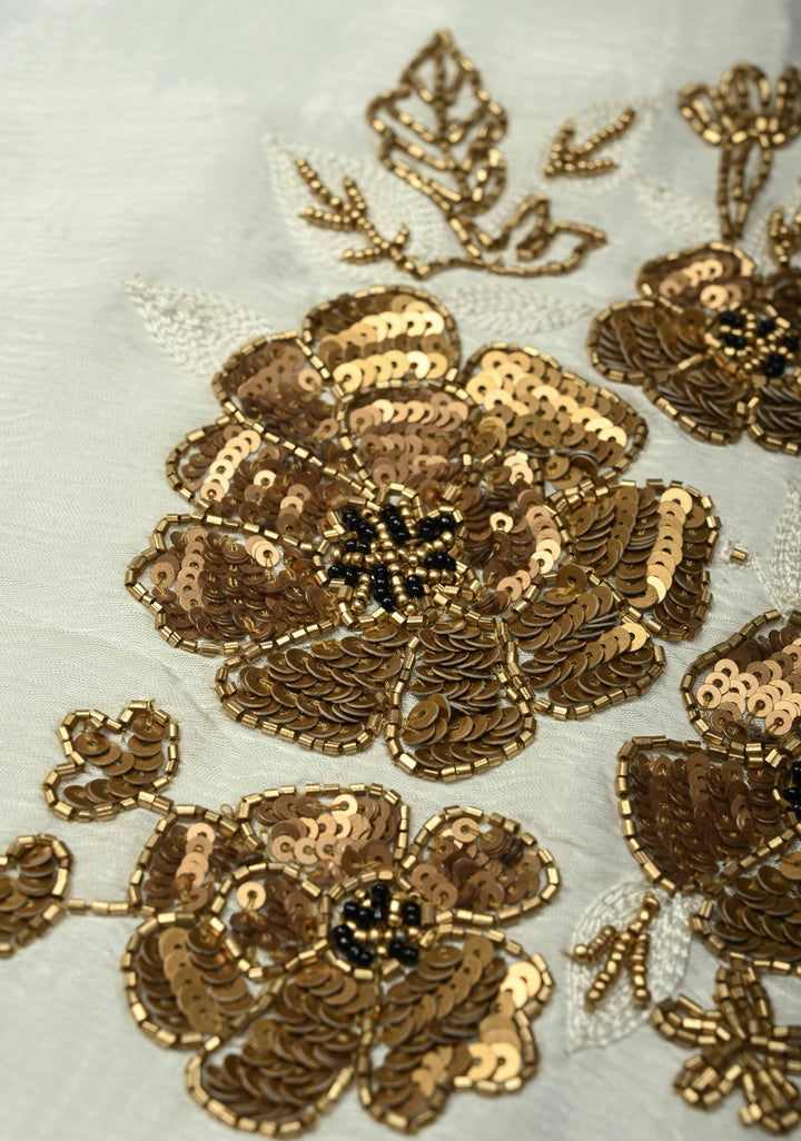 Ivory Satin Georgette Saree with Antique Matte Finish Cutdana, Sequins and Moti Embellishment and Scallop Border