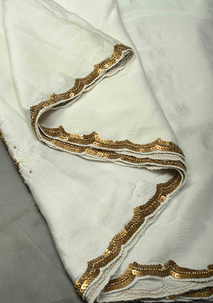 Ivory Satin Georgette Saree with Antique Matte Finish Cutdana, Sequins and Moti Embellishment and Scallop Border