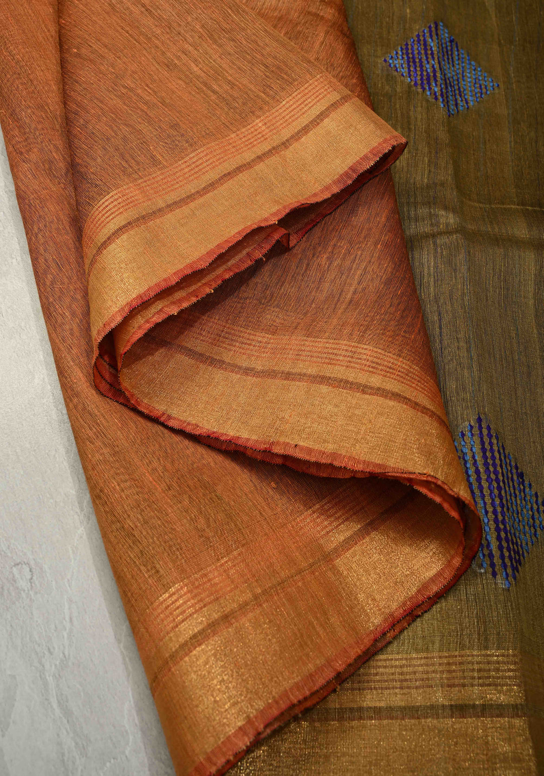 Rust Orange Handwoven Silk Linen Saree with Thread Buttas and Muted Zari Border