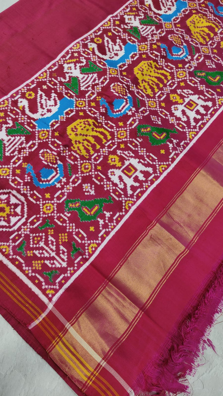 Celebrity Authentic Double Ikkat Patan Patola Handwoven Saree in Pinkish Red Dual tone with Flora Fauna Motifs on Border | SILK MARK CERTIFIED