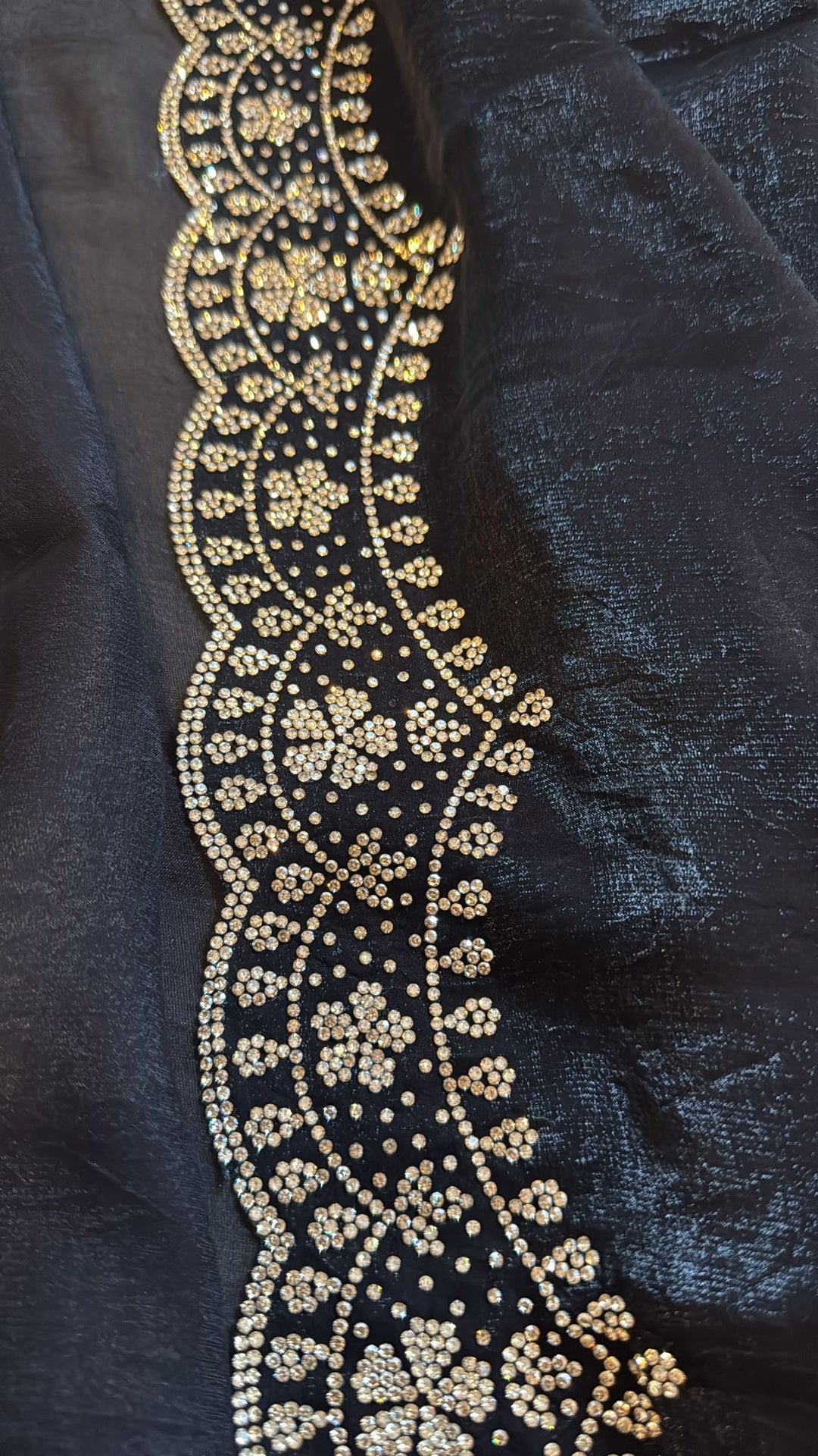 Black satin Georgette with stone work border and blouse piece