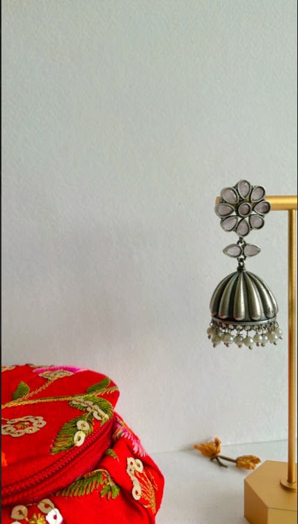 White Karina Jhumkas in Brass with Antique Silver Polish | SHOBITAM