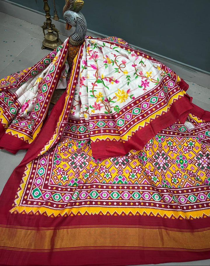 Authentic Double Ikkat Patan Patola Handwoven Saree in Off White with Parsi Gara Hand Embroidery and Patli Pallu   | SILK MARK CERTIFIED | SHOBITAM