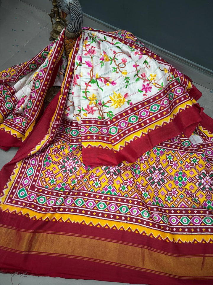 Authentic Double Ikkat Patan Patola Handwoven Saree in Off White with Parsi Gara Hand Embroidery and Patli Pallu   | SILK MARK CERTIFIED | SHOBITAM