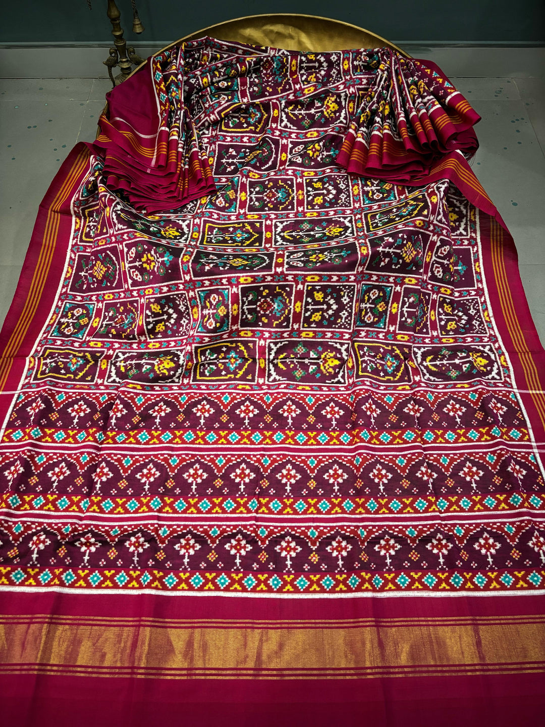 Authentic Double Ikkat Patan Patola Pure Silk Handwoven  Saree in Deep Plum with Persian Arches Floral Motifs Design | SILK MARK CERTIFIED