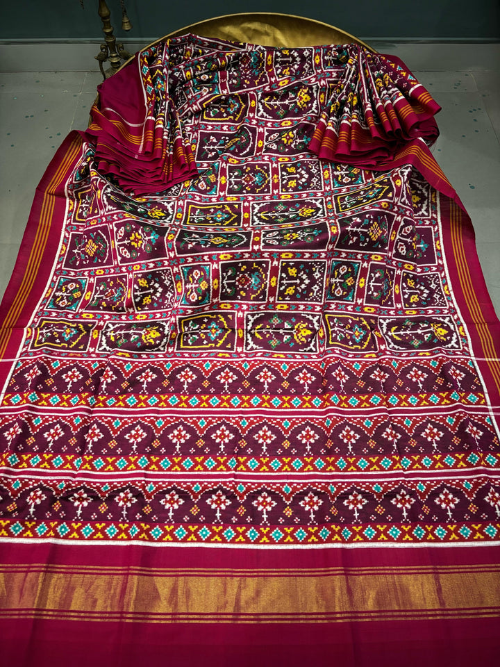 Authentic Double Ikkat Patan Patola Pure Silk Handwoven  Saree in Deep Plum with Persian Arches Floral Motifs Design | SILK MARK CERTIFIED