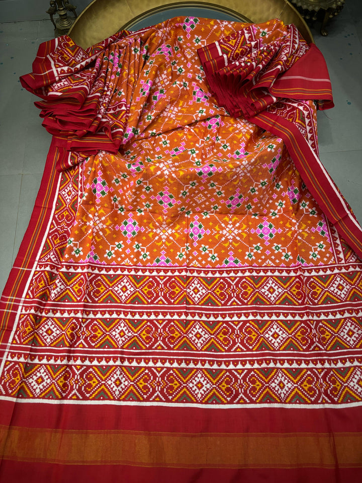Authentic Double Ikkat Patan Patola Pure Silk Handwoven  Saree in Rust Orange with Navaratna Design | SILK MARK CERTIFIED