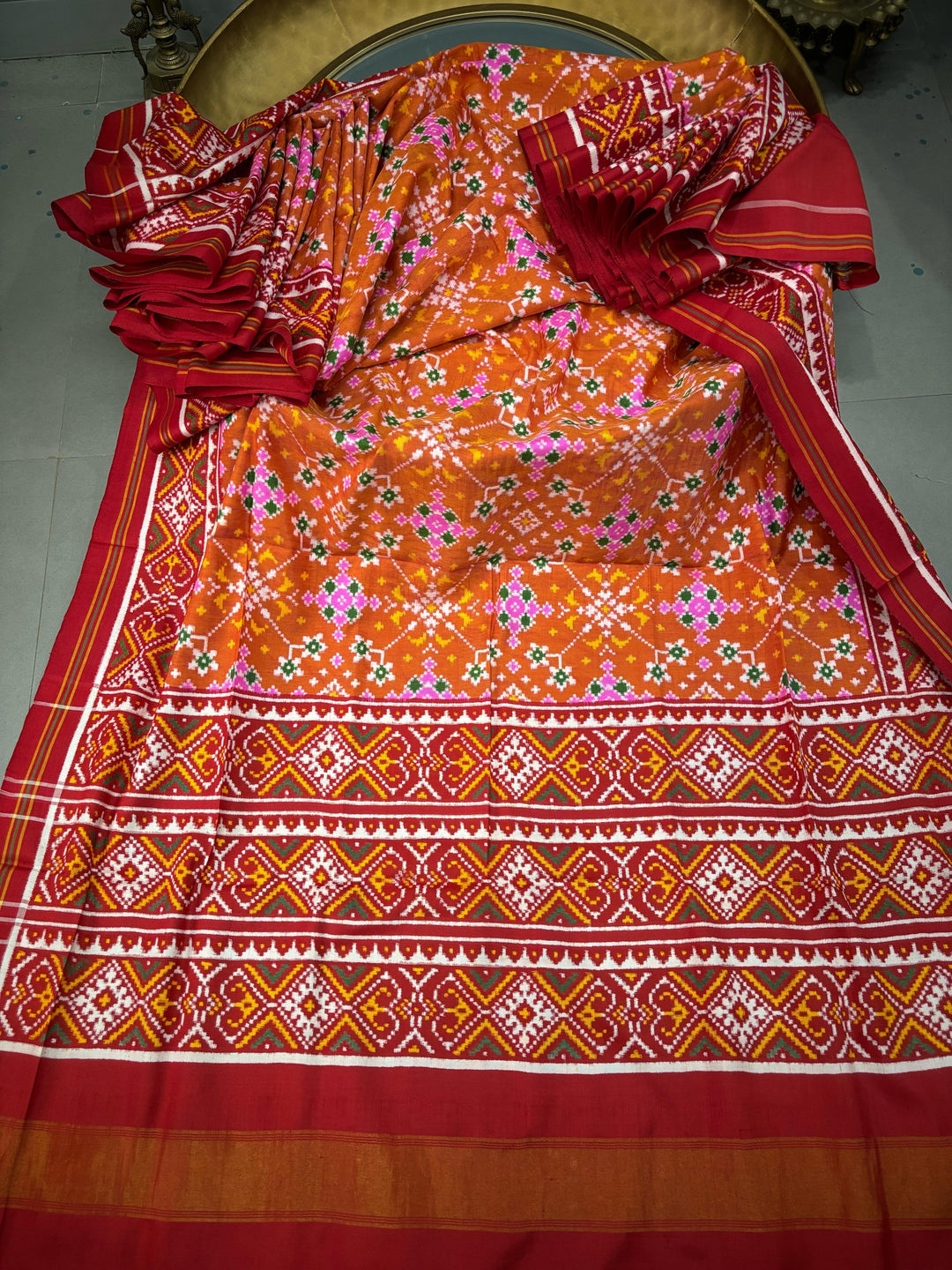 Authentic Double Ikkat Patan Patola Pure Silk Handwoven  Saree in Rust Orange with Navaratna Design | SILK MARK CERTIFIED