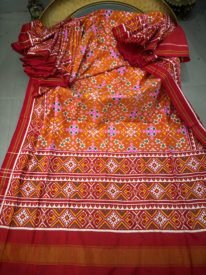 Authentic Double Ikkat Patan Patola Pure Silk Handwoven  Saree in Rust Orange with Navaratna Design | SILK MARK CERTIFIED