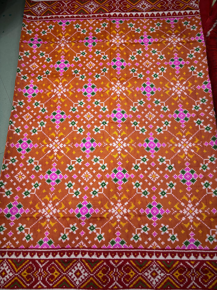 Authentic Double Ikkat Patan Patola Pure Silk Handwoven  Saree in Rust Orange with Navaratna Design | SILK MARK CERTIFIED