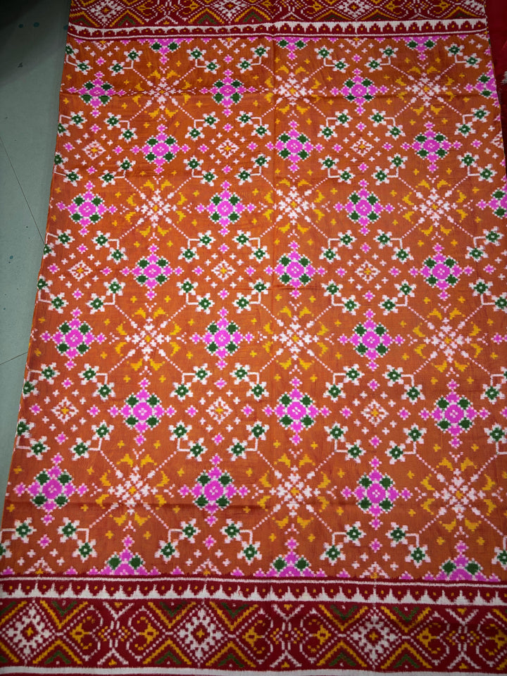 Authentic Double Ikkat Patan Patola Pure Silk Handwoven  Saree in Rust Orange with Navaratna Design | SILK MARK CERTIFIED