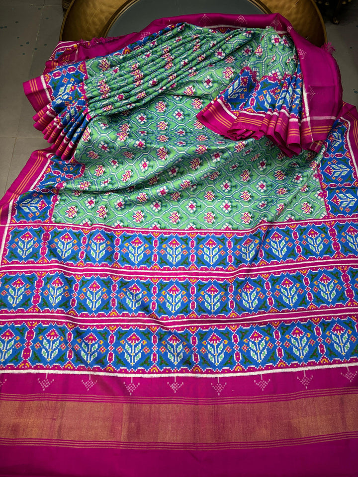 Authentic Double Ikkat Patan Patola Pure Silk Handwoven  Saree in Mint Green with Anar Buttas and Contrast Border | SILK MARK CERTIFIED | SHOBITAM