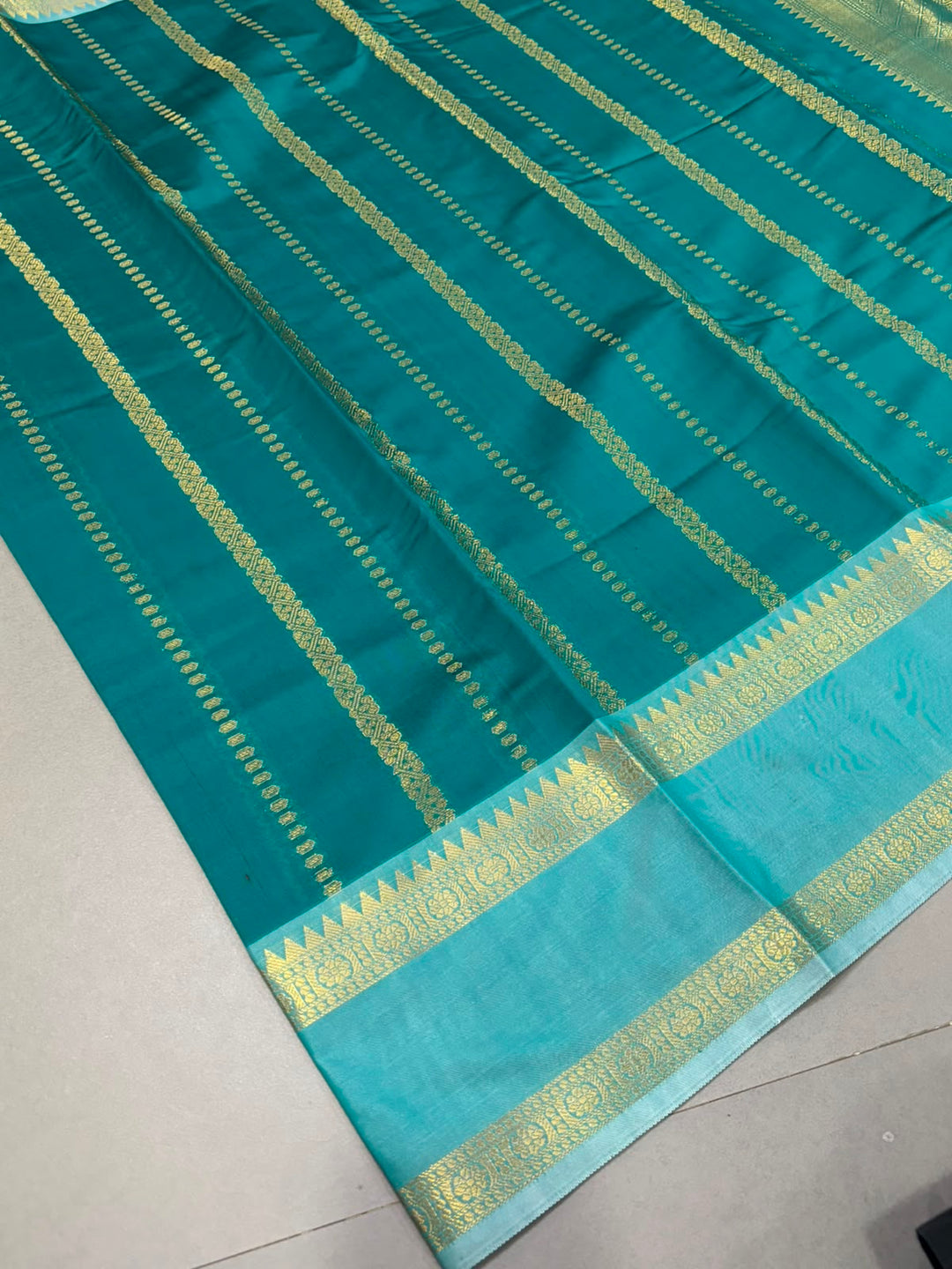 Green Kanjivaram Soft Semi Silk Saree with Ornate Zari Stripes and Rettaipet Zari Border | SHOBITAM