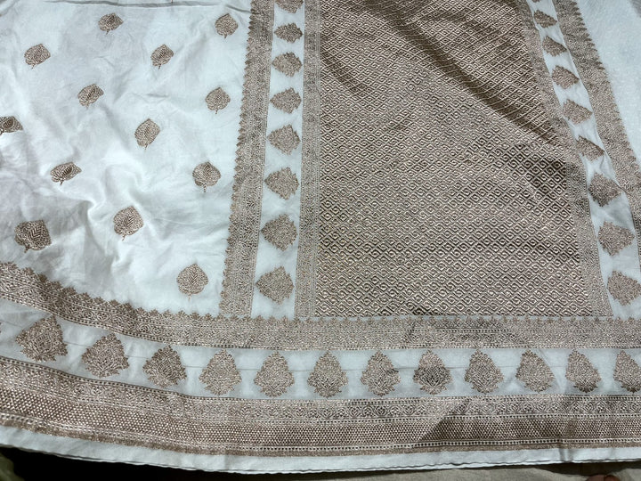 White Semi Mashru Banarasi Silk Saree with Floral Butta and Zari Border
