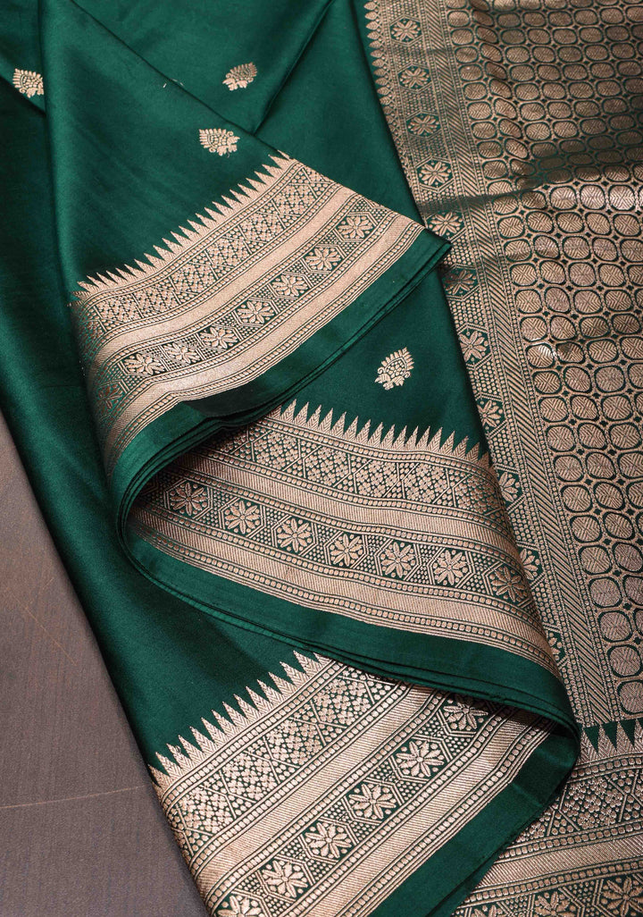 Exquisite Bottle Green Banarasi Mashru Silk Saree with Floral Buttas and zari Border | SILK MARK CERTIFIED
