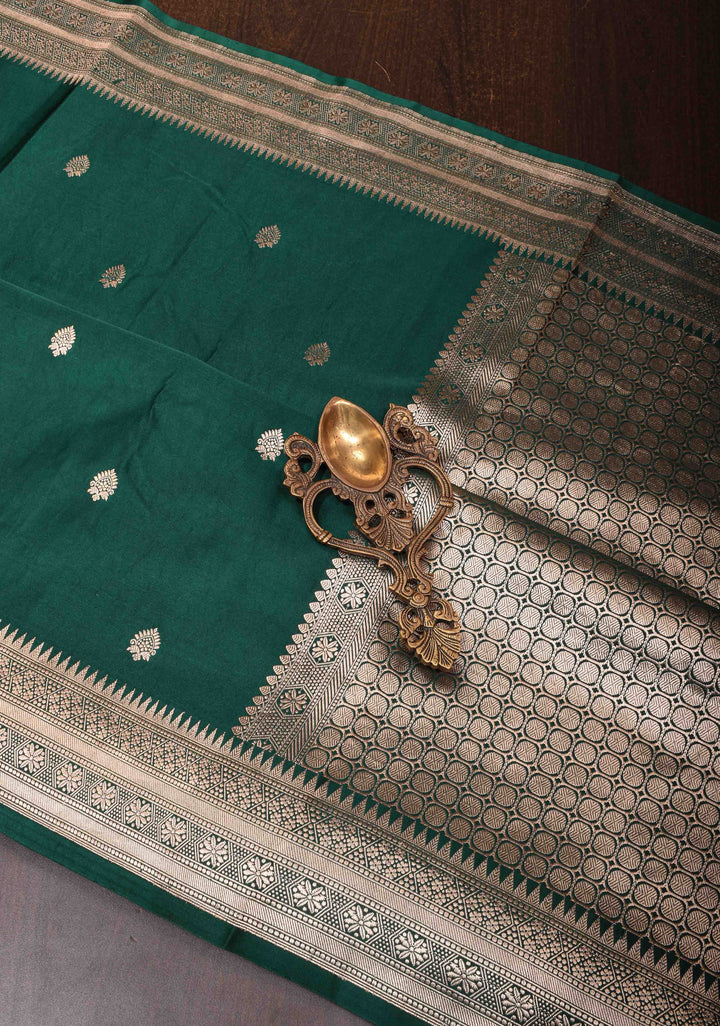 Exquisite Bottle Green Banarasi Mashru Silk Saree with Floral Buttas and zari Border | SILK MARK CERTIFIED