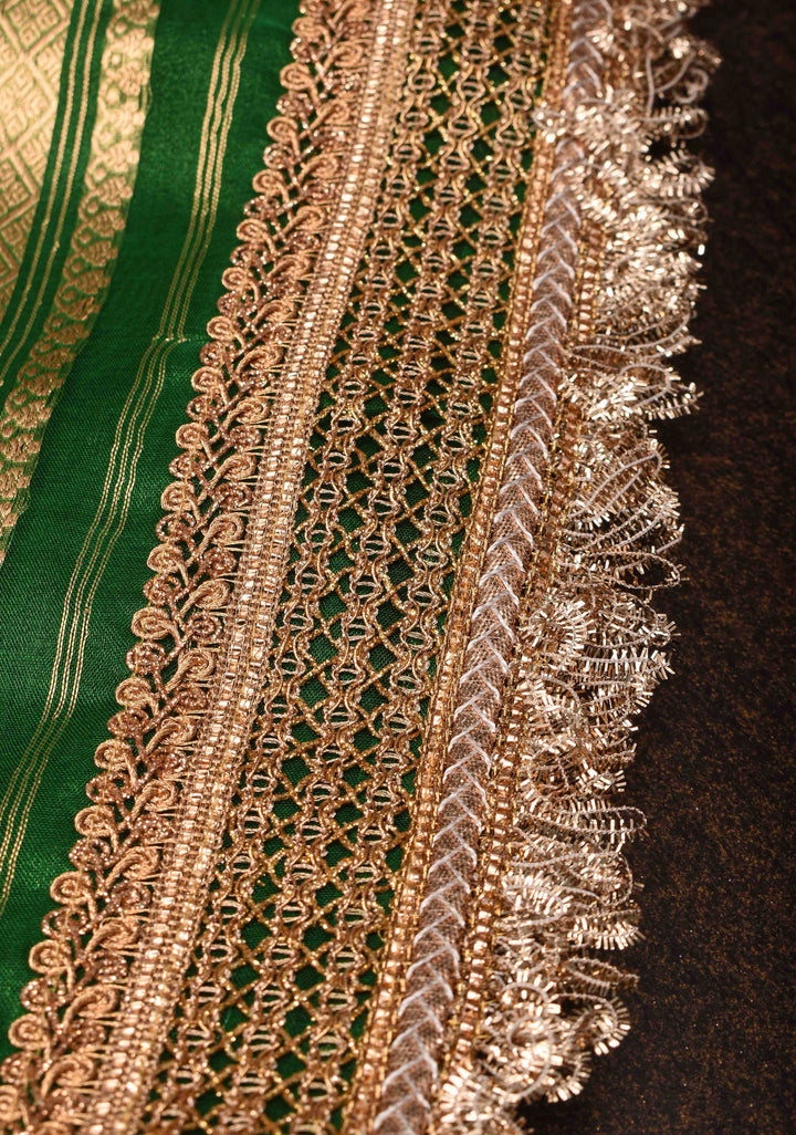 Bottle Green Banarasi Tissue Handloom Saree with Sona Rupa Buttis and Lace Border | SILK MARK CERTIFIED