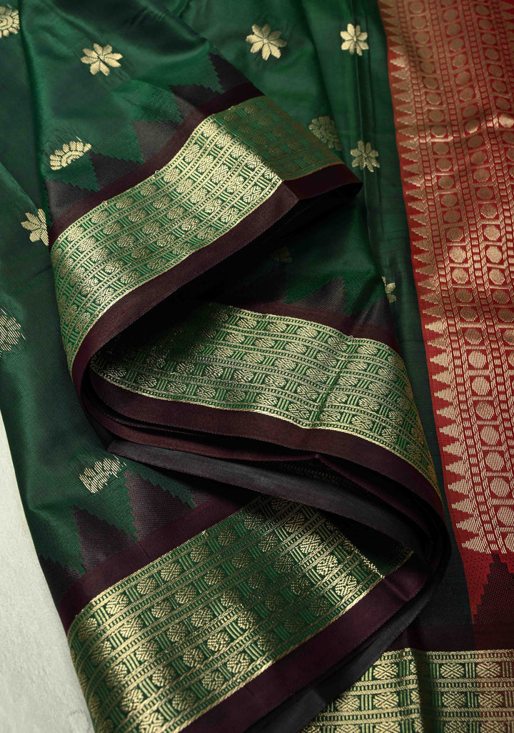 Dark Green Semi Silk Saree with Floral Buttas and Temple Zari Border