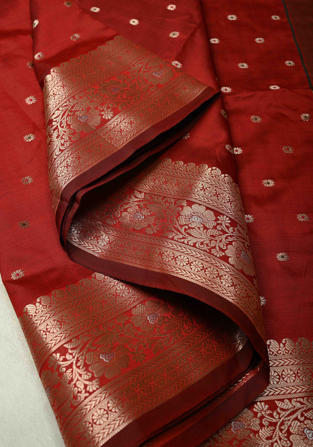Deep Red Semi Silk Saree with Meenakari Buttas and Alfi Zari Border