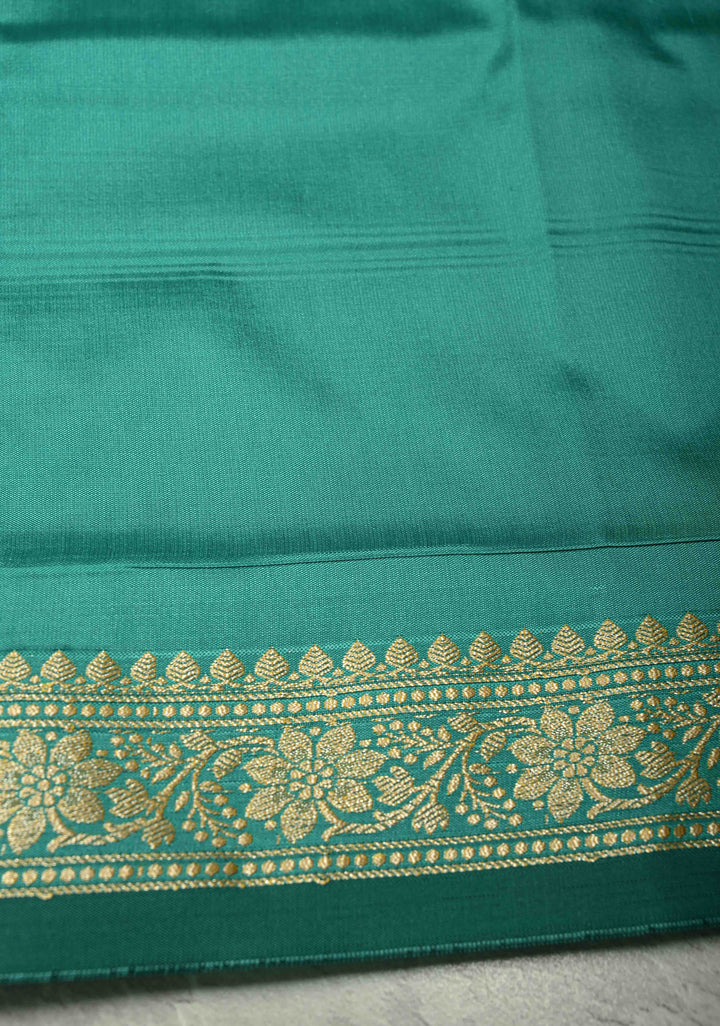 Dark Mint Semi Silk Saree with Chunri Buttis and Minimal Zari Border