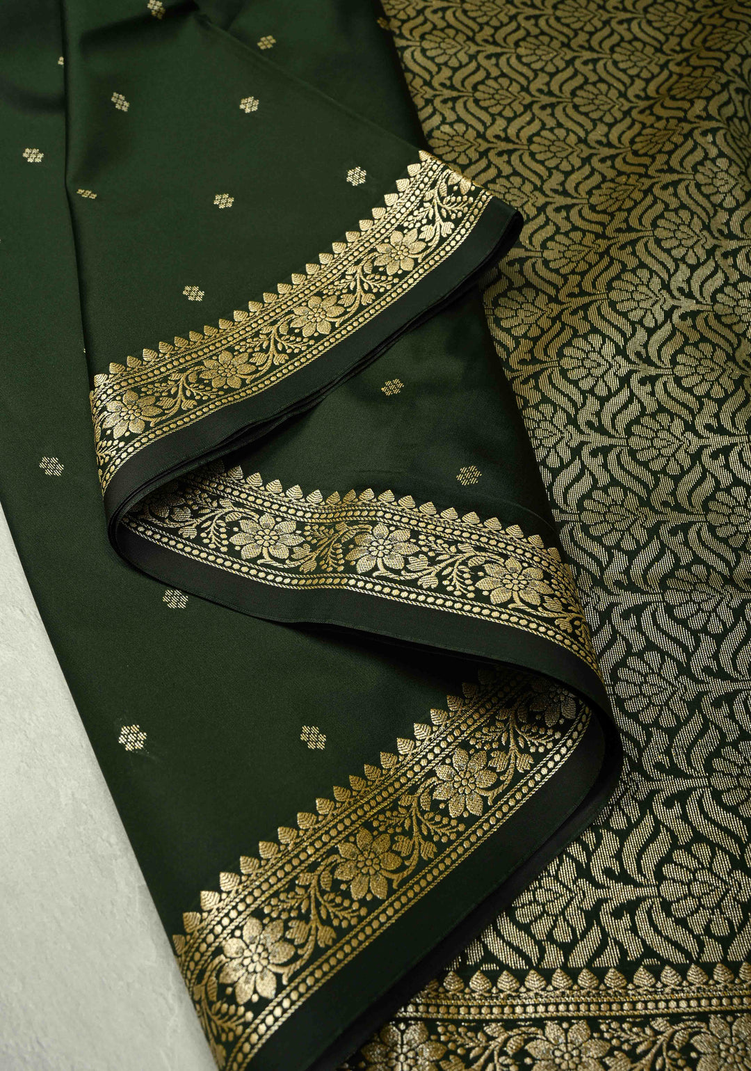 Deep Green Semi Silk Saree with Chunri Buttis and Minimal Zari Border