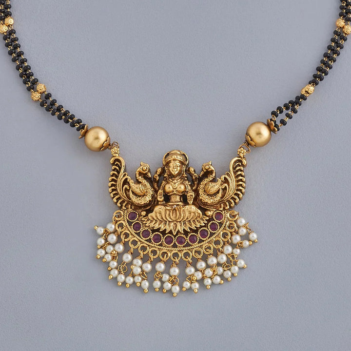 Ornate Gold-Plated Mangalsutra with Lakshmi Motif and Pearl Embellishments
