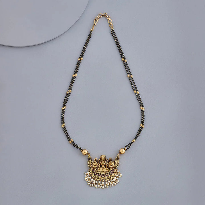 Ornate Gold-Plated Mangalsutra with Lakshmi Motif and Pearl Embellishments