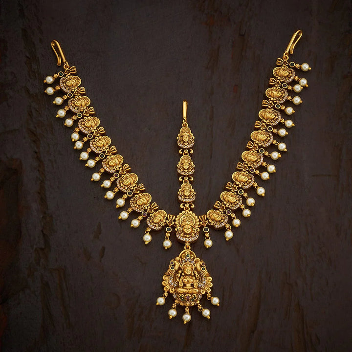 Lakshmi Penmdant and Motif Antique Tikka with dangling pearls
